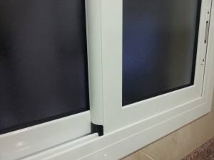 White lacquered sliding window
