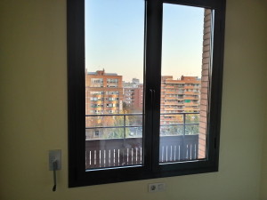 Double-paned window with thermal and acoustic glass